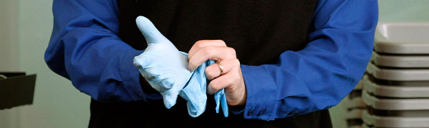 TSA agent dons rubber gloves