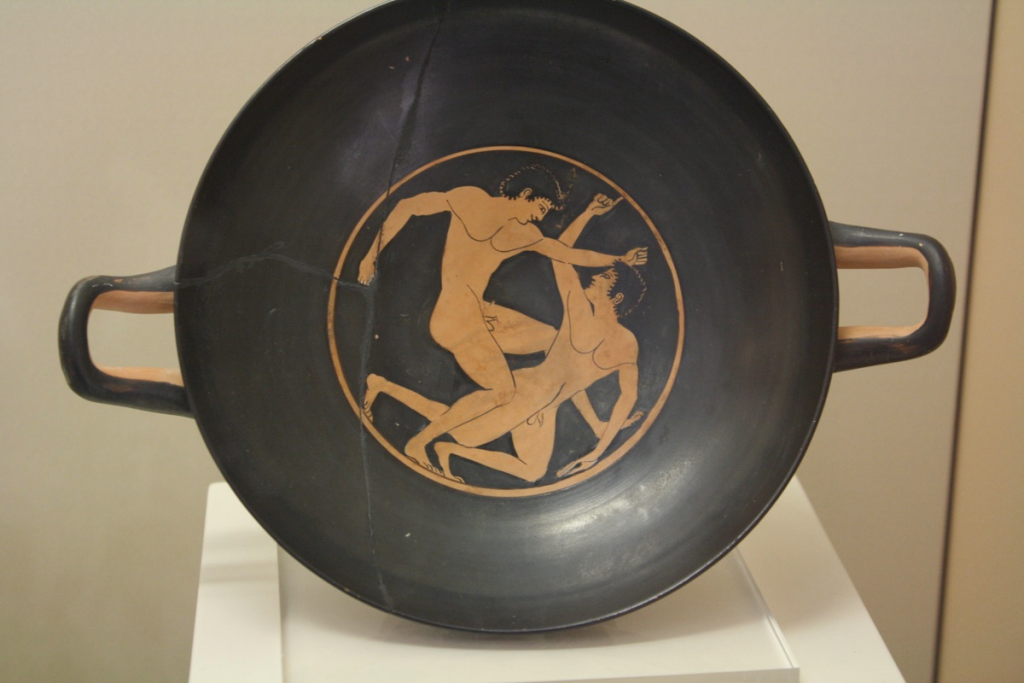 A boxing scene from an attic red-figure kylix (c. 500 BCE). Olympia Archaeological Museum.